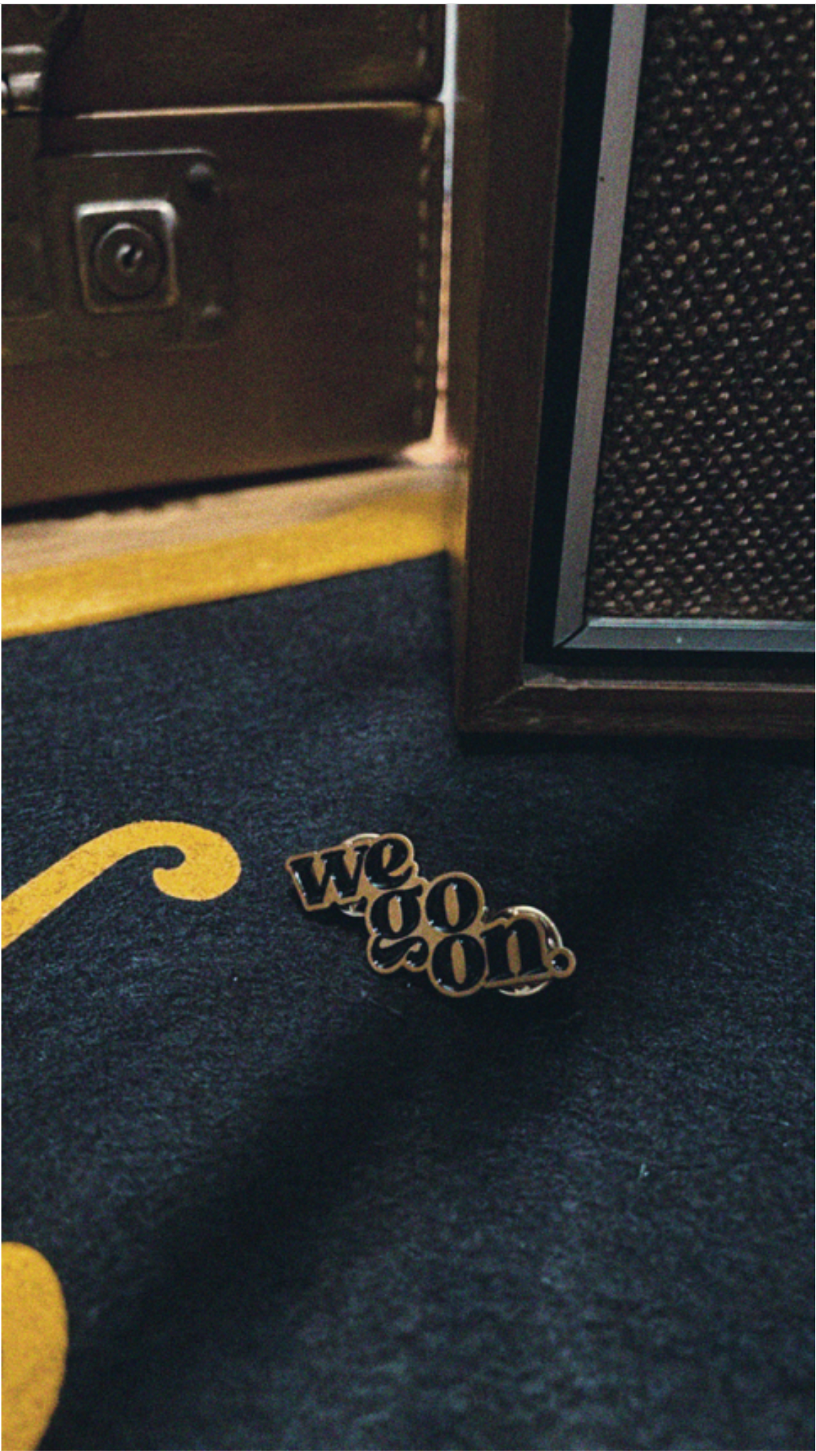 We Go On Lapel Pin